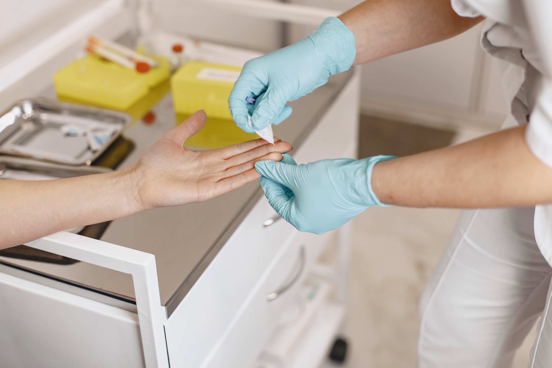 Hands Putting Plaster on Wound