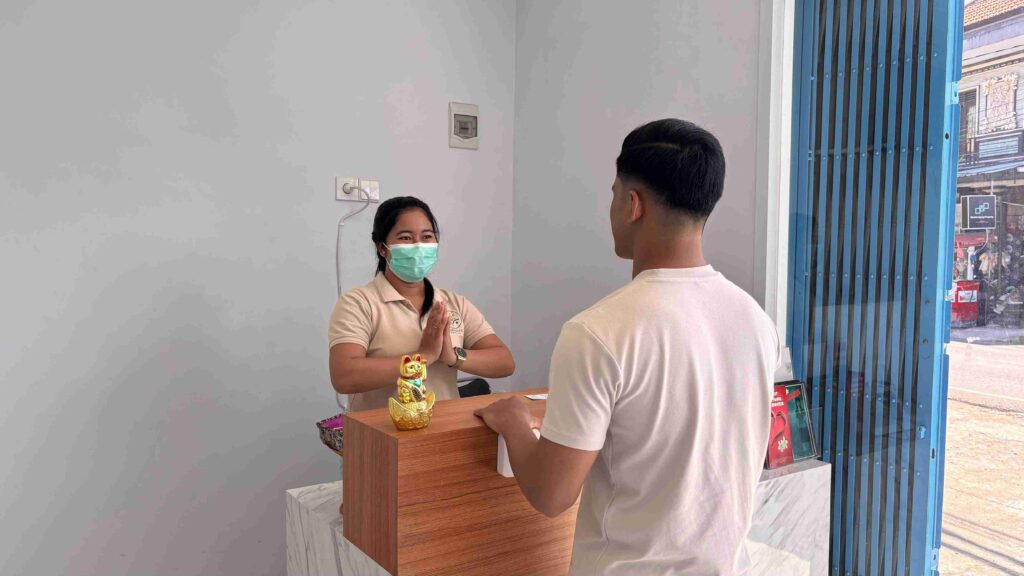 Front desk staff assisting patient registration – Nawadipa Medical Care, Pererenan Health Services.